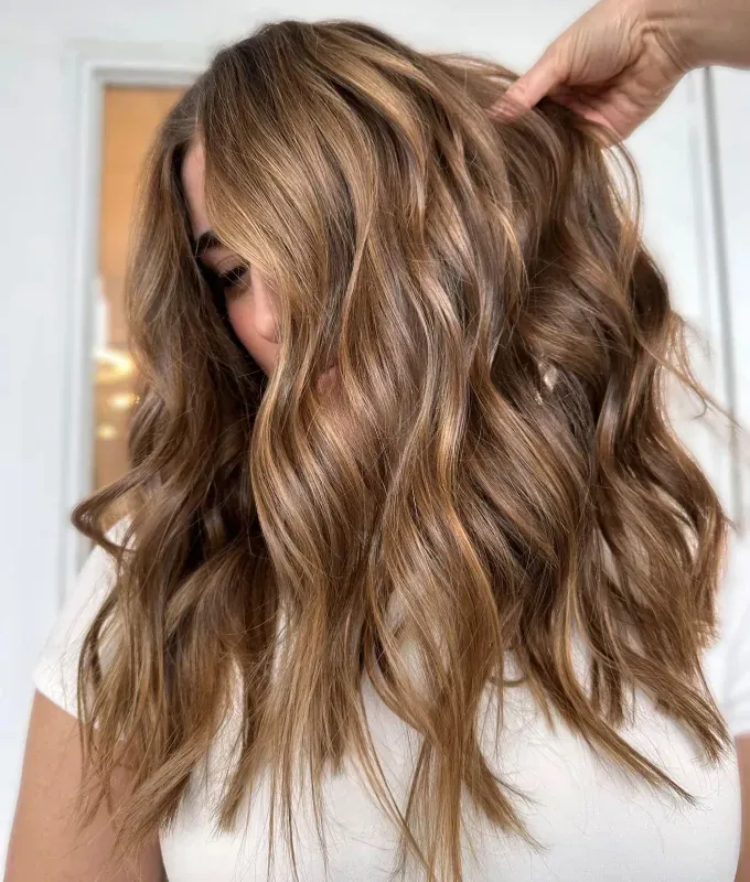 honey-brown hair ideas honey drizzled hair: a photo of a woman’s hair' fetchpriority='auto' title='30 Honey-Brown Hair Ideas According to Hairstylists