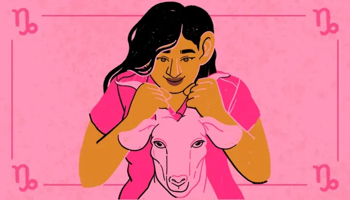 A cheeky image of a woman of color with dark hair holding a pink goat by the horns. The background is pink and her shirt is darker pink.' fetchpriority='auto' title='Your Monthly Horoscopes: May 2025
