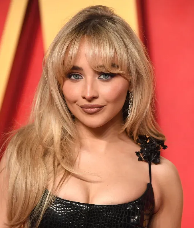 celebrities with bangs a photo of sabrina carpenter rocking curtain bangs' fetchpriority='auto' title='From Taylor Swift to Zendaya Here Are 7 Celebrities with Bangs to Inspire Your Next Haircut
