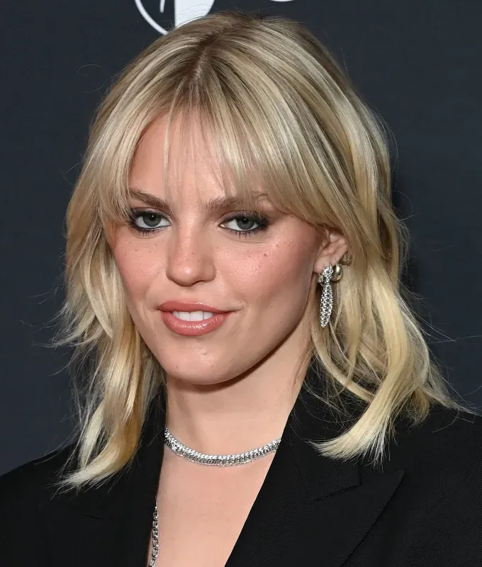 celebrities with bangs a photo of renee rapp with wispy bangs' fetchpriority='auto' title='From Taylor Swift to Zendaya Here Are 7 Celebrities with Bangs to Inspire Your Next Haircut