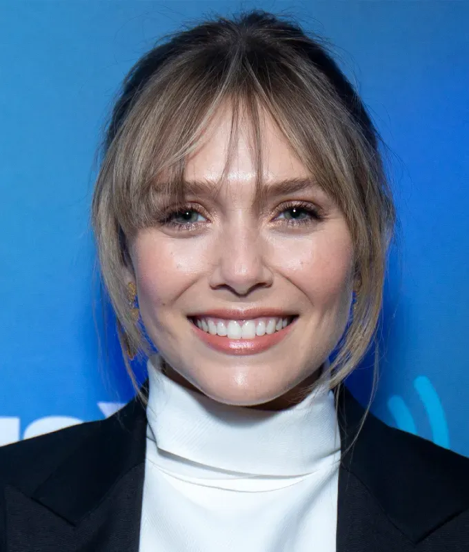 haircuts for oval faces: elizabeth olson wispy fringe bangs' fetchpriority='auto' title='The 36 Most Flattering Haircuts & Hair Styles for Oval Faces