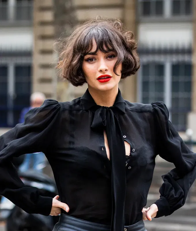 haircuts for oval faces: curly french bob on taylor lashae' fetchpriority='auto' title='The 36 Most Flattering Haircuts & Hair Styles for Oval Faces