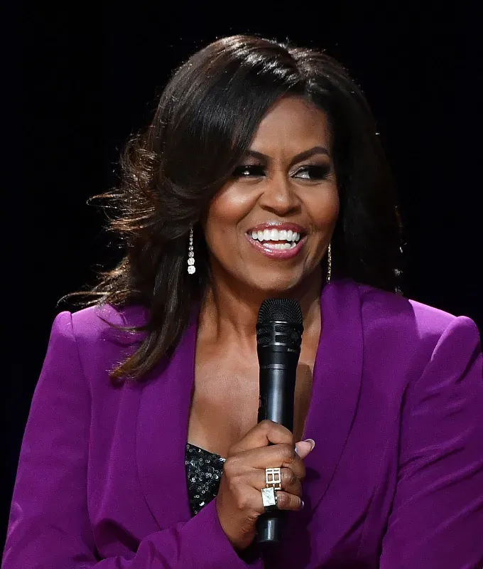 silk press hairstyles a photo of michelle obama rocking voluminous curls' fetchpriority='auto' title='18 Silk Press Hairstyles to Elevate Your Silky Smooth Blowout