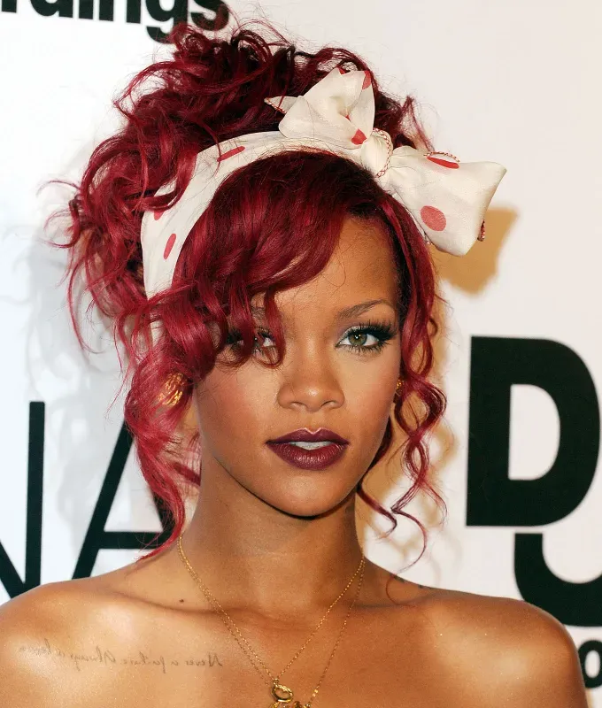 rihanna hairstyles dark red updo' fetchpriority='auto' title='A Timeline of Rihanna’s Hairstyles From Pon De Replay to Fenty Beauty