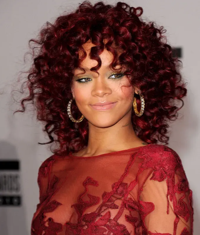 rihanna hairstyles corkscrew curls' fetchpriority='auto' title='A Timeline of Rihanna’s Hairstyles From Pon De Replay to Fenty Beauty
