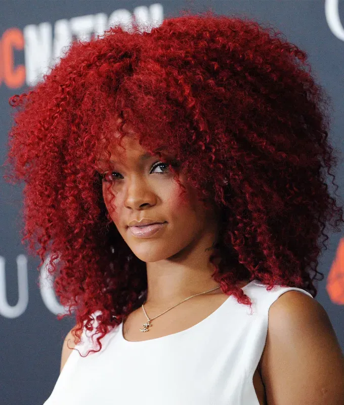 rihanna hairstyles voluminous curls' fetchpriority='auto' title='A Timeline of Rihanna’s Hairstyles From Pon De Replay to Fenty Beauty