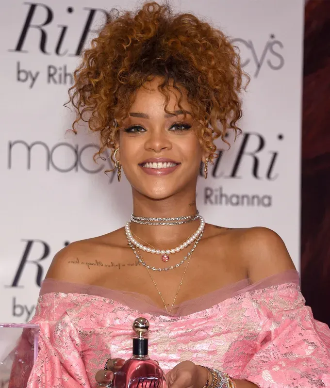 rihanna hairstyles honey blonde curls' fetchpriority='auto' title='A Timeline of Rihanna’s Hairstyles From Pon De Replay to Fenty Beauty