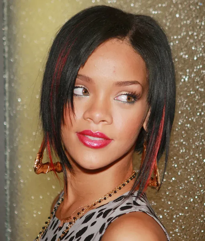 rihanna hairstyles red highlights' fetchpriority='auto' title='A Timeline of Rihanna’s Hairstyles From Pon De Replay to Fenty Beauty