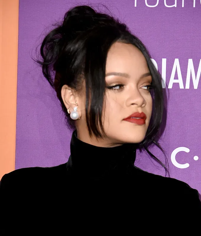 rihanna hairstyles 90s updo' fetchpriority='auto' title='A Timeline of Rihanna’s Hairstyles From Pon De Replay to Fenty Beauty