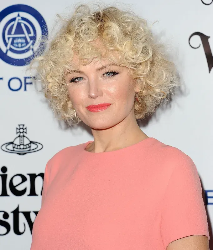 best haircuts for round faces short curly cut' fetchpriority='auto' title='The 36 Best Haircuts for Round Faces