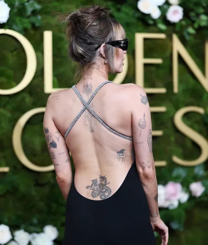 tramp stamps are back miley cyrus' fetchpriority='auto' title='TikTok is Begging Millennials to Reconsider *this* Tattoo Trend