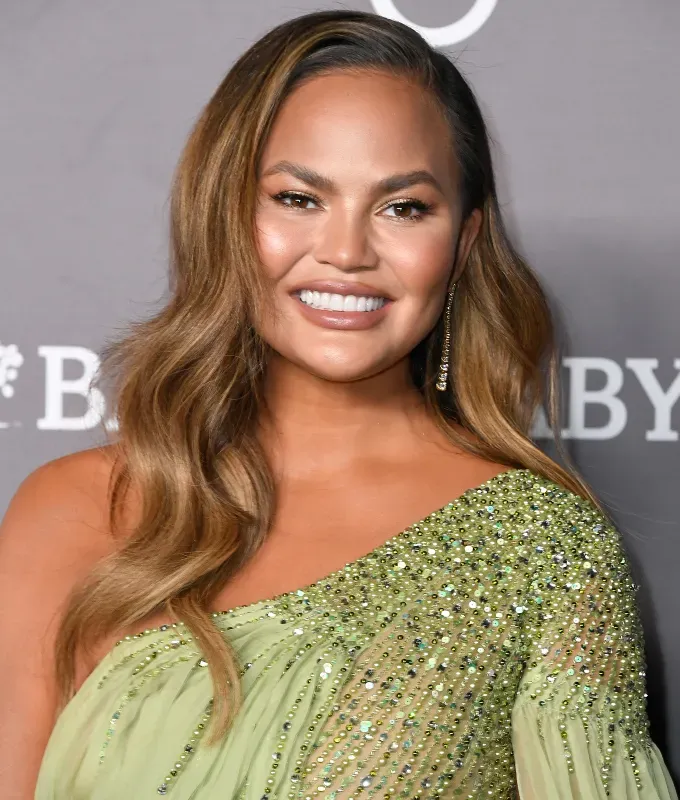brown to blonde hair chrissy teigen' fetchpriority='auto' title='How to Go From Brown to Blonde Hair Without Frying It According to a Celerity Hairstylist