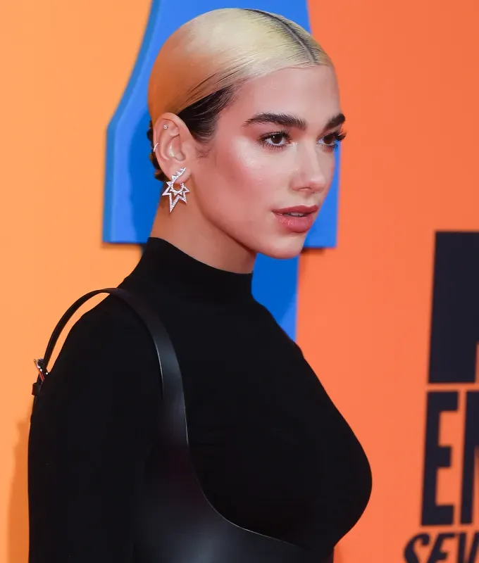 brown to blonde hair Dua Lipa' fetchpriority='auto' title='How to Go From Brown to Blonde Hair Without Frying It According to a Celerity Hairstylist
