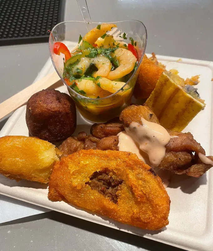 bad bunny concert review: assorted puerto rican appetizers' fetchpriority='auto' title='I Went to Puerto Rico for Bad Bunny’s DeBí TiRAR Más FOToS Show (& It Was More Moving Than Expected)