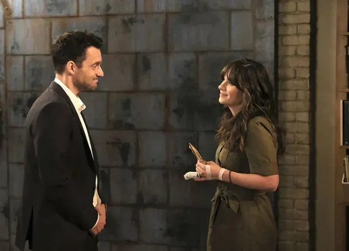 best tv couples jess and nick' fetchpriority='auto' title='The 55 Best TV Couples of All Time Including ‘Stranger Things’ ‘The Office’ & More