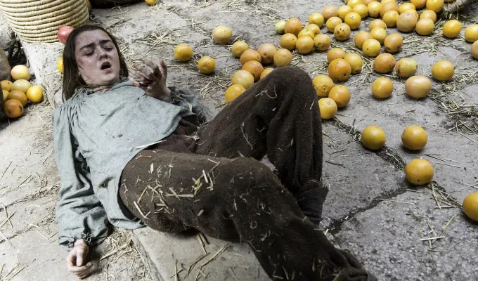Game of Thrones Seasons Ranked - Arya dressed as a peasant on the stone ground looking shaken next to a dozen or so fallen oranges.' fetchpriority='auto' title='What Is the Best Season of ’Game of Thrones’? We Ranked All Eight from Worst to Greatest