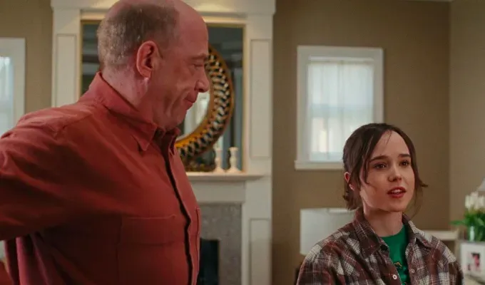 Movies About Pregnancy - Eliott Page stands talking to someone off-screen while his co-star stands and stares at him.' fetchpriority='auto' title='25 Movies About Pregnancy That Will Make You Laugh Cry and Give You All the Feels (And Not Because of Hormones)