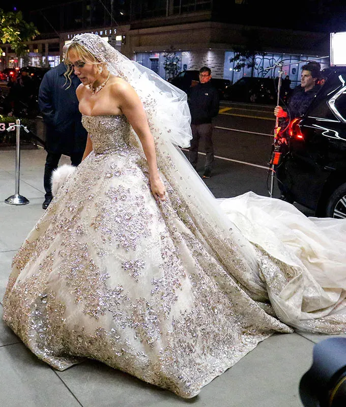 every-wedding-dress-jlo-has-ever-worn: J.Lo on set in her Marry Me character’s stage dress' fetchpriority='auto' title='Every Wedding Dress J.Lo Has Ever Worn Ranked