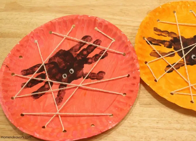 handprint spiders in a paper plate web halloween crafts for kids' title='The 75 Best Halloween Crafts for Kids in 2025