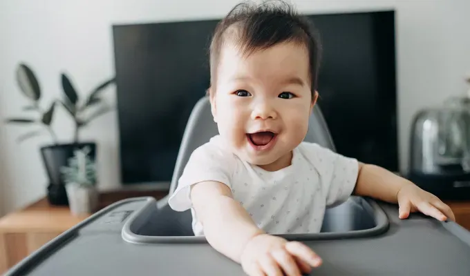 baby on high chair' fetchpriority='auto' title='50 Baby Boy Names That Start With J