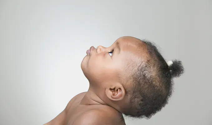 uncommon baby names: african american baby looks at ceiling' fetchpriority='auto' title='150 Uncommon Baby Names to Help Your Child Stand Out from the Crowd