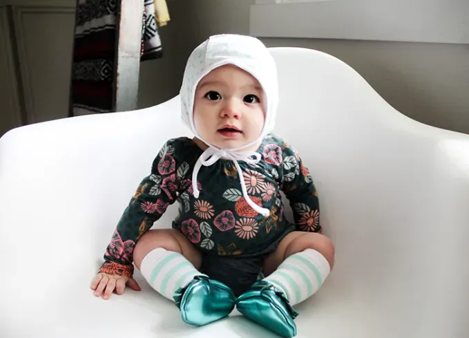 baby names that mean moon little girl in bonnet' fetchpriority='auto' title='52 Baby Names That Mean Moon