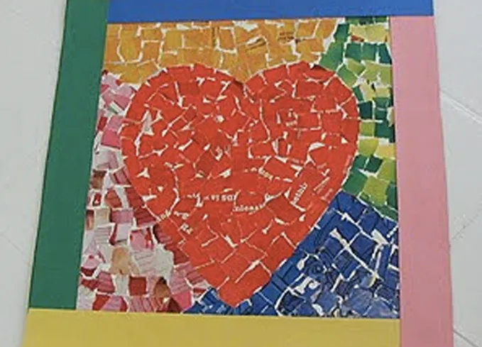 52 Fun and Easy Valentine’s Day Crafts for Kids - A paper mache-type Valentine’s mosaic made with different colors of paper brought together to make a red heart with pink yellow green and blue colors as a border.' title='70 Fun and Easy Valentine’s Day Crafts for Kids