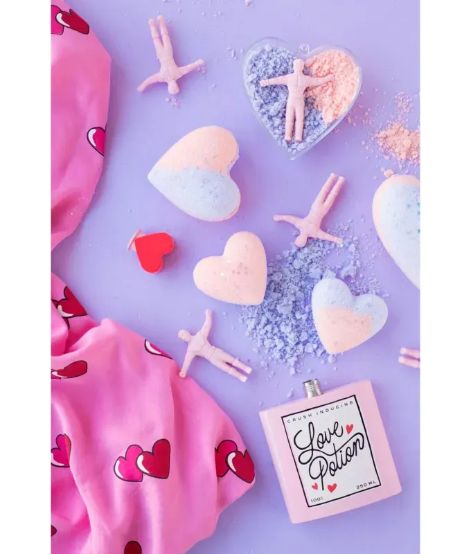 valentines-crafts-for-kids: A flat lay of bath bombs that are shaped like hearts with tiny men sprinkled across the table.' title='70 Fun and Easy Valentine’s Day Crafts for Kids