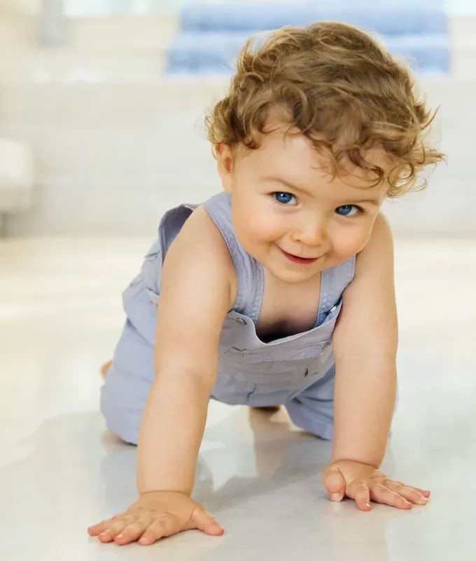 A baby with a magical and mystical name crawls on the ground.' fetchpriority='auto' title='50 Mystical and Magical Baby Names That Will Put You Under a Spell