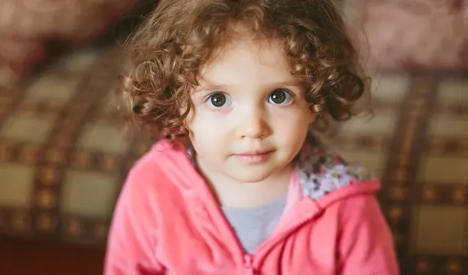 A little child with a mystical and magical name looks at camera.' fetchpriority='auto' title='50 Mystical and Magical Baby Names That Will Put You Under a Spell