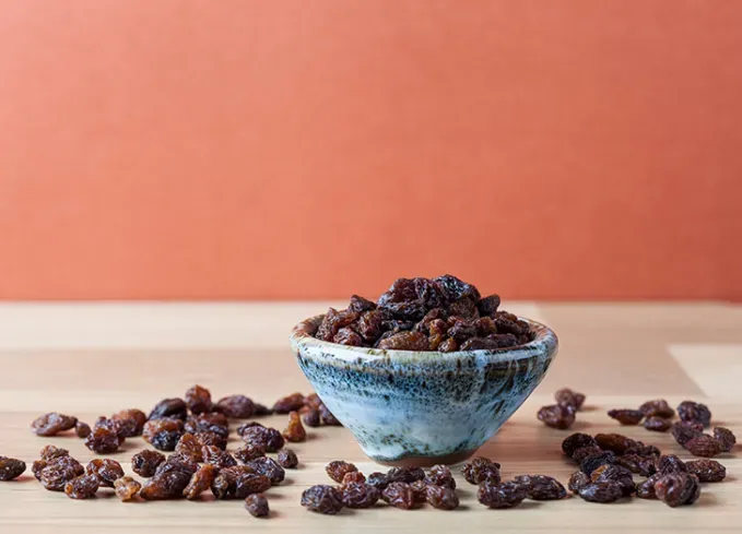 what fruits can dogs eat raisins' fetchpriority='auto' title='What Fruits Can Dogs Eat? Here’s What’s OK and What to Avoid According to Veterinarians