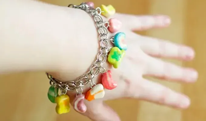 St. Patrick’s Day Crafts for Kids: young girl wearing a Lucky Charms Bracelet' title='30 Fun and Easy St. Patrick’s Day Crafts for Kids