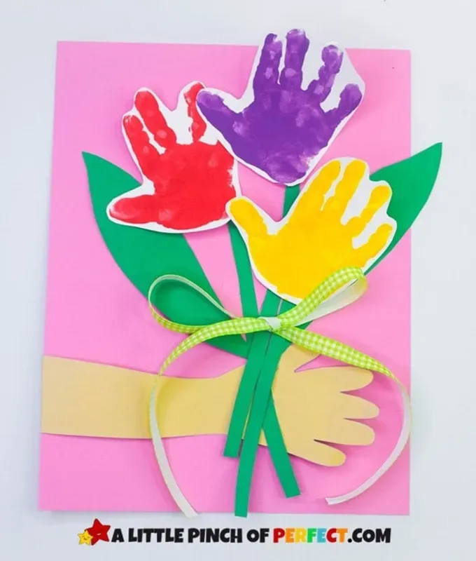 mothers-day-crafts-for-kids: paint handprints made into a paper flower bouquet' title='45 Mother’s Day Crafts for Kids That She’ll Actually Want to Keep