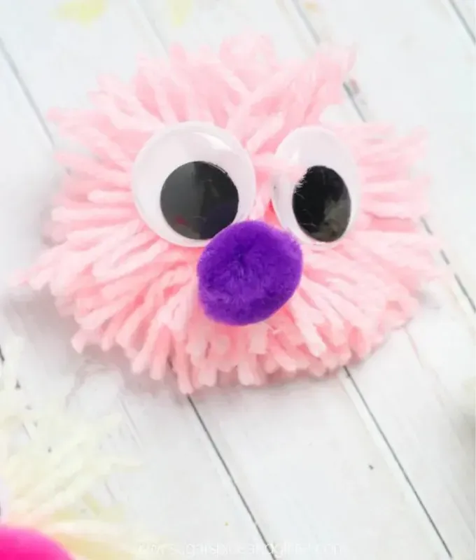mothers-day-crafts: a pop pom with craft eyes' title='45 Mother’s Day Crafts for Kids That She’ll Actually Want to Keep