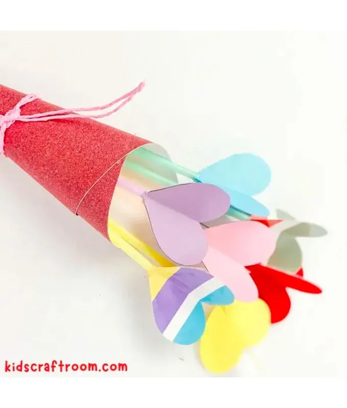 mothers-day-crafts: A colorful bouquet of heart shaped flowers in a red cone.' title='45 Mother’s Day Crafts for Kids That She’ll Actually Want to Keep