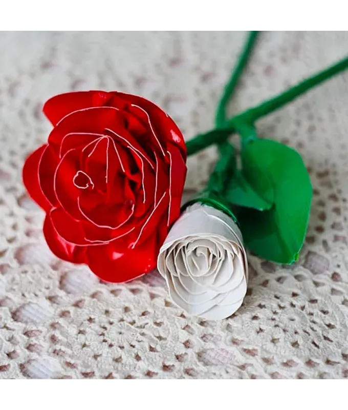 mothers-day-crafts: Two duct tape roses one red and one white sitting on a white doily.' title='45 Mother’s Day Crafts for Kids That She’ll Actually Want to Keep