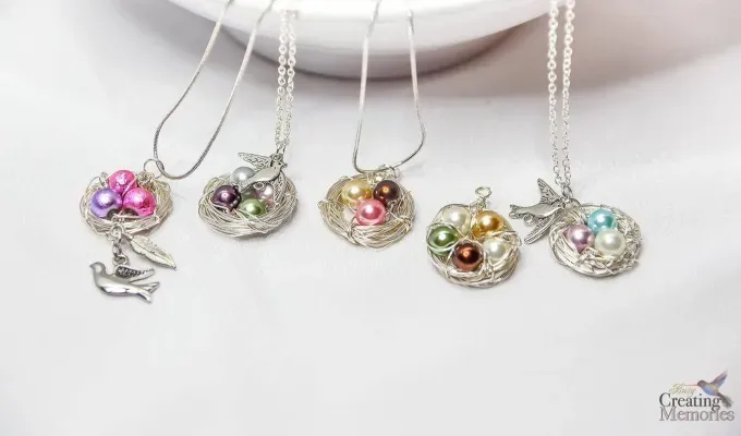 mothers-day-crafts-for-kids: silver necklaces with colorful birds nest pendants' fetchpriority='auto' title='45 Mother’s Day Crafts for Kids That She’ll Actually Want to Keep