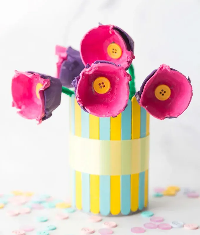 mothers-day-crafts: A colorful bouquet of egg carton flowers in a popsicle stick vase.' title='45 Mother’s Day Crafts for Kids That She’ll Actually Want to Keep