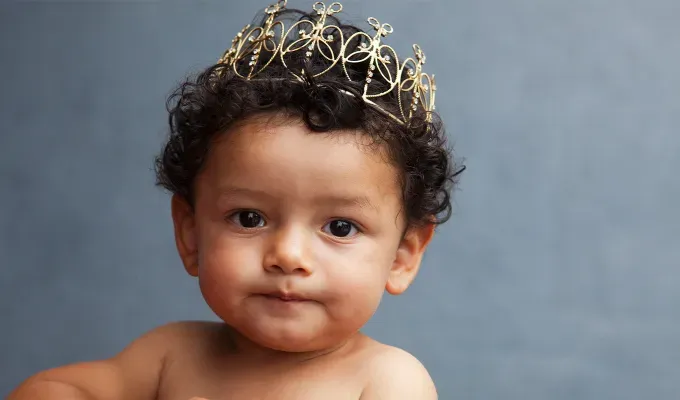 names-that-mean-fire: a baby boy wearing a golden crown.' fetchpriority='auto' title='100 Baby Names That Mean Fire Perfect for the Formidable Bun in Your Oven