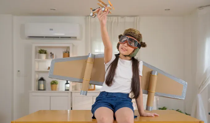 last-minute-halloween-costumes-for-kids: a young girl wearing wings and a pilot hat' fetchpriority='auto' title='53 Last-Minute Halloween Costume Ideas for Kids in 2025