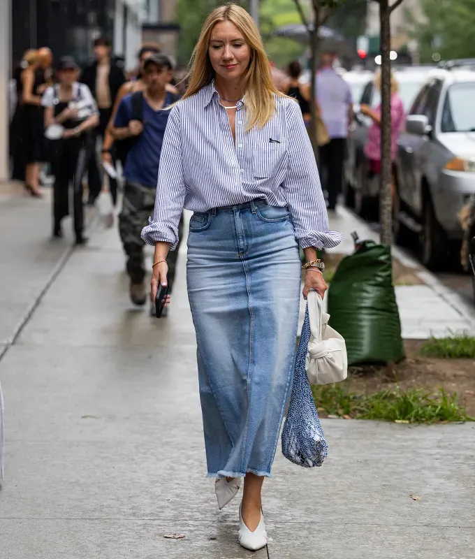 A woman wearing a denim maxi skirt and white pointy toe pumps.' fetchpriority='auto' title='6 Shoes to Wear with Denim Maxi Skirts to Impress All Your Fashion Friends