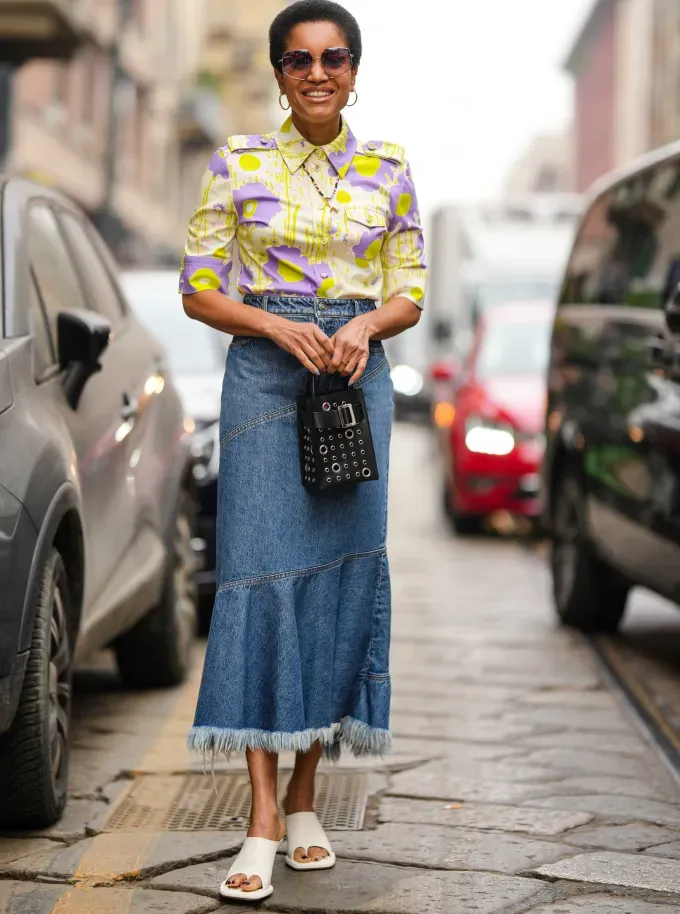 A woman wearing a denim midi skirt and white flat sandals' fetchpriority='auto' title='6 Shoes to Wear with Denim Maxi Skirts to Impress All Your Fashion Friends