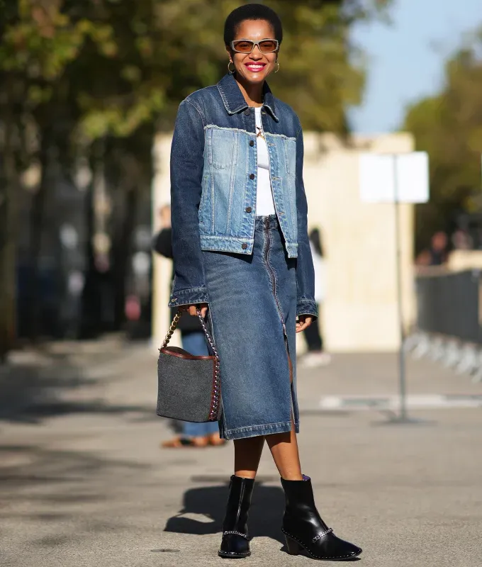 A woman wearing a denim midi skirt with black chelsea boots' fetchpriority='auto' title='6 Shoes to Wear with Denim Maxi Skirts to Impress All Your Fashion Friends