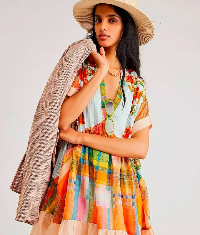 Stores Like Lulus: flowy colorful dress with a houndstooth blazer and straw fedora hat from Free People' title='20 Stores Like Lulus to Shop Right Now