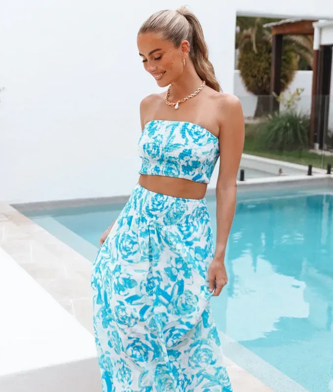 Stores Like Lulus: woman by the pool wearing the ADA SET in BLUE from Petal and Pup' title='20 Stores Like Lulus to Shop Right Now