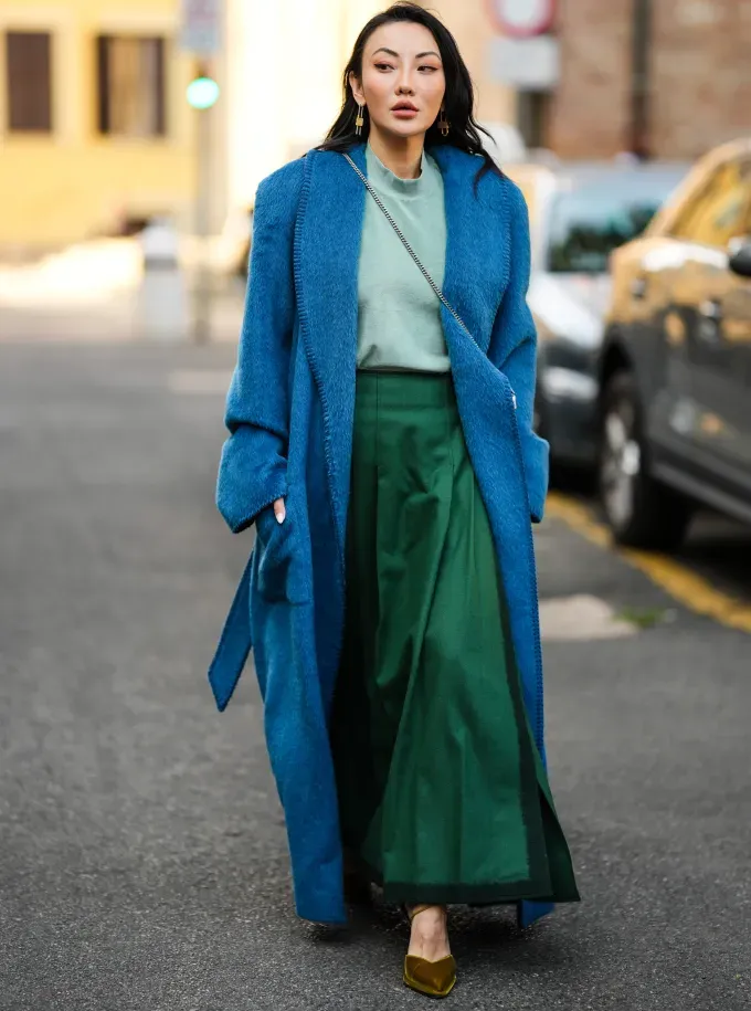 woman wearing shades of blue and green' fetchpriority='auto' title='31 Outfit Ideas for a Sparkly Stylish and Rather Festive December