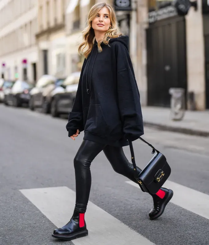 woman wearing faux leather leggings december outfit ideas 2022' fetchpriority='auto' title='31 Outfit Ideas for a Sparkly Stylish and Rather Festive December