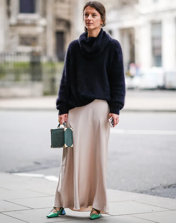 woman wearing an oversize sweater and slip dress' fetchpriority='auto' title='31 Outfit Ideas for a Sparkly Stylish and Rather Festive December