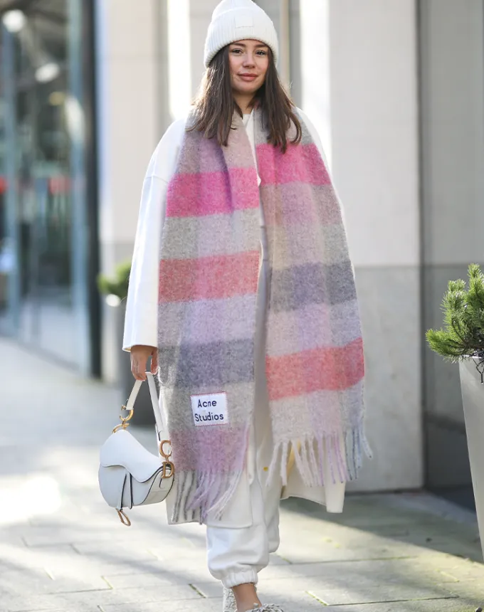 woman wearing a large colorful scarf' fetchpriority='auto' title='31 Outfit Ideas for a Sparkly Stylish and Rather Festive December