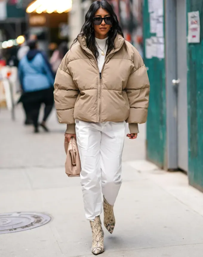 woman wearing a beige puffer coat' fetchpriority='auto' title='31 Outfit Ideas for a Sparkly Stylish and Rather Festive December
